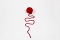 Red skein of thread against white background. Red ball of wool red thread isolated on white Royalty Free Stock Photo