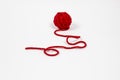 Red skein of thread against white background. Red ball of wool red thread isolated on white Royalty Free Stock Photo