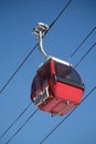 Red ski gondola in clear blue sky overhead Royalty Free Stock Photo