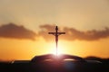 Red sky and clouds and light and the cross and bible of the death and resurrection of Jesus Christ Royalty Free Stock Photo