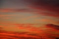 Red sky with feather clouds at sunset in the evening