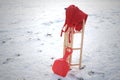 Red Sledge and warm trousers in snow landscape Royalty Free Stock Photo