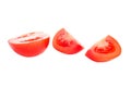 Red sliced isolated tomatoes with water drops