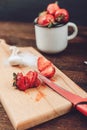 Red sliced strawberry prepared for fruit dryer rack. Fresh strawberries are cleaned and cut Royalty Free Stock Photo