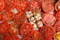 red sliced tomatoes, sprinkled with spices and garlic