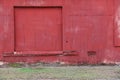 Red sliding barn door old abandoned farm building Royalty Free Stock Photo