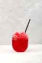 Red Slush. Spanish fruit granizado drink. Sweet Shaved ice. Glass of Refreshing summer iced drink. Vertical orientation, copy Royalty Free Stock Photo