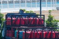 Red small cylinders for gas supply to the population, loaded on the back of a truck for delivery. Cooking and heating Royalty Free Stock Photo