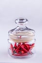 Red small spisy chili peppers in glass jar Royalty Free Stock Photo