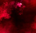Red smoke over black background Royalty Free Stock Photo
