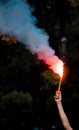 Red smoke stick at a football match