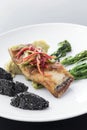 Red snapper fish fillet with vegetables and black sesame rice Royalty Free Stock Photo