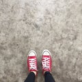 Red Sneakers Shoes Walking On Dirty Concrete Top View , Canvas Shoes Walking On Concrete