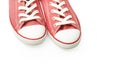 Red sneakers on a white background. Youth shoes