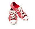 Red sneakers on a white background. Youth shoes