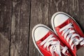 Red sneakers on wooden background.Toned image Royalty Free Stock Photo