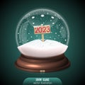 2023 red Snow globe on green background. Merry Christmas and Happy New Year 2023. Realistic christmas snow globe with red 2023 Royalty Free Stock Photo