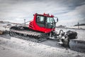 Red snow-grooming machine on snow Royalty Free Stock Photo