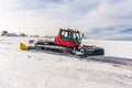 Red snow-grooming machine on snow Royalty Free Stock Photo