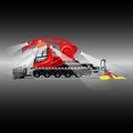 Red snowcat with headlights, crane, bucket and machine compacted snow