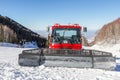 Red snowcat on ski slopes Royalty Free Stock Photo