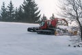 Red snowcat on snow in the winter in mountains Royalty Free Stock Photo