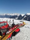 Red snowcat waits to groom the snow Royalty Free Stock Photo