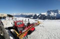 Red snowcat waits to groom the snow Royalty Free Stock Photo