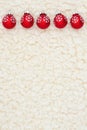 Red snowflakes ornaments winter background on beige sherpa material