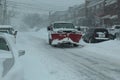 Red snowplow on a pickup truck during a heavy snowstorm Royalty Free Stock Photo