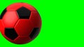 Red soccer ball on green chroma key text space.