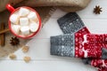 Red cup of hot cacao with marshmallow and Christmas sock with or Royalty Free Stock Photo