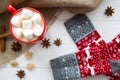 Red cup of hot cacao with marshmallow and Christmas sock with or Royalty Free Stock Photo