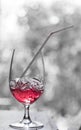 Red soda with ice in design glass over blurred background Royalty Free Stock Photo