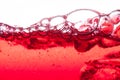 Red soda water splashing with bubbles close up and Dew Point on Royalty Free Stock Photo