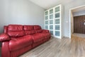 Red sofa in empty room Royalty Free Stock Photo