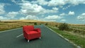 Red sofa in the middle of the road