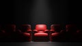 Red sofa Seat in front of black wall with spotight, 3d render Royalty Free Stock Photo
