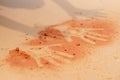 Red soil hand shape on sand in aboriginal art style Royalty Free Stock Photo