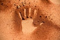 Red soil hand shape on sand like aboriginal art style Royalty Free Stock Photo