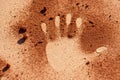 Red soil hand shape on sand like aboriginal art style Royalty Free Stock Photo