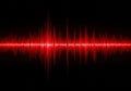 Red sound waves oscillation on black background with bright frequency pulse visualization Royalty Free Stock Photo