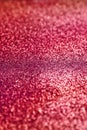 Red sparkling background. Abstract twinkled red glittering texture with bokeh, defocused lights for Christmas holiday, banner,