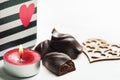 Red sparkling lit candle and dark chocolate Royalty Free Stock Photo