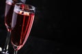 Red sparkling wine, black background, selective focus Royalty Free Stock Photo