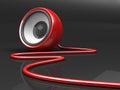 Red speaker with cable over grey