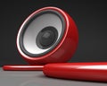 Red speaker with cable over grey Royalty Free Stock Photo