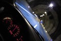 Red speedometer dash board inside a car cockpit