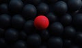 Red sphere among black spheres, contrasting colors, 3D rendering, abstract composition, focus on singularity Royalty Free Stock Photo