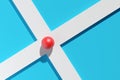 Red sphere on crossing of two white roads over cyan background, way finding, decision making minimal modern concept